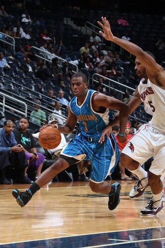 ATLANTA - OCTOBER 7: Chris Paul #3 of the New Orleans Hornets drives against Al Horford #15 of the Atlanta Hawks during a preseason game on October 7, 2009 at Philips Arena in Atlanta, Georgia.  <br /><br /><span class="help">(Photo by Scott Cunningham/NBAE via Getty Images)</span>