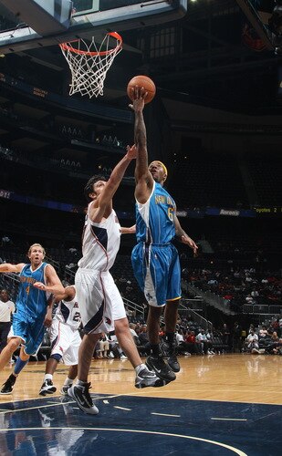 ATLANTA - OCTOBER 7: Bobby Brown #6 of the New Orleans Hornets puts up a shot against Zaza Pachulia #27 of the Atlanta Hawks during a preseason game on October 7, 2009 at Philips Arena in Atlanta, Georgia.  <br /><br /><span class="help">(Photo by Scott Cunningham/NBAE via Getty Images)</span>