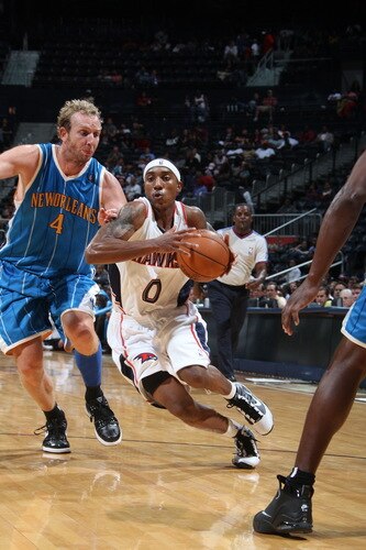 ATLANTA - OCTOBER 7: Jeff Teague #0 of the Atlanta Hawks drives against Sean Marks #4 of the New Orleans Hornets during a preseason game on October 7, 2009 at Philips Arena in Atlanta, Georgia.  <br /><br /><span class="help">(Photo by Scott Cunningham/NBAE via Getty Images)</span>