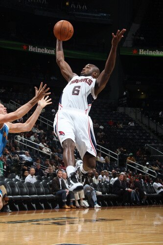 ATLANTA - OCTOBER 7: Mario West #6 of the Atlanta Hawks grabs a rebound against the New Orleans Hornets during a preseason game on October 7, 2009 at Philips Arena in Atlanta, Georgia.  <br /><br /><span class="help">(Photo by Scott Cunningham/NBAE via Getty Images)</span>