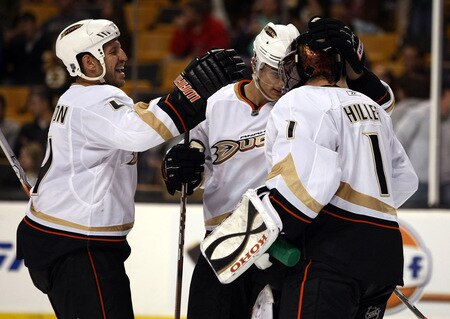 BOSTON - OCTOBER 08: Jonas Hiller #1 of the Anaheim Ducks is congratulated by teammates Luca Sbisa #5 and Nick Boynton #4 after the win over the Boston Bruins on October 8, 2009 at the TD Garden in Boston, Massachusetts. The Ducks defeated the Bruins 6-1.  <br /><br /><span class="help">(Photo by Elsa/Getty Images)</span>