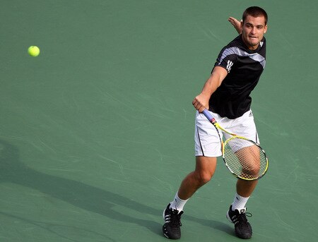 TOKYO - OCTOBER 09:  Mikhail Youzhny of Russia plays a backhand in his match against Tomas Berdych of the Czech Republic during day five of the Rakuten Open Tennis tournament at Ariake Colosseum on October 9, 2009 in Tokyo, Japan.  <br /><br /><span class="help">(Photo by Koichi Kamoshida/Getty Images)</span>