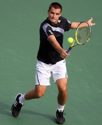 TOKYO - OCTOBER 09:  Mikhail Youzhny of Russia plays a backhand in his match against Tomas Berdych of the Czech Republic during day five of the Rakuten Open Tennis tournament at Ariake Colosseum on October 9, 2009 in Tokyo, Japan.  <br /><br /><span class="help">(Photo by Koichi Kamoshida/Getty Images)</span>