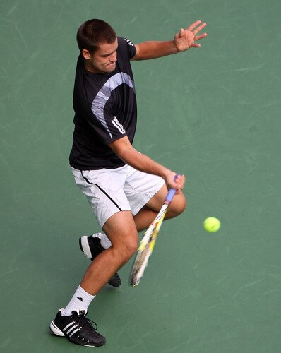TOKYO - OCTOBER 09:  Mikhail Youzhny of Russia plays a forehand in his match against Tomas Berdych of the Czech Republic during day five of the Rakuten Open Tennis tournament at Ariake Colosseum on October 9, 2009 in Tokyo, Japan.  <br /><br /><span class="help">(Photo by Koichi Kamoshida/Getty Images)</span>