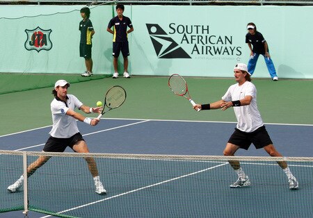 TOKYO - OCTOBER 09: Christopher Kas of Germany and Jaroslav Levinsky of the Czech Republic returns a shot in their doubles match against Frantisek Cermak of the Czech Republic and Michal Mertinak of Slovakia during day five of the Rakuten Open Tennis tournament at Ariake Colosseum on October 9, 2009 in Tokyo, Japan. <br /><br /><span class="help">(Photo by Koji Watanabe/Getty Images)</span>