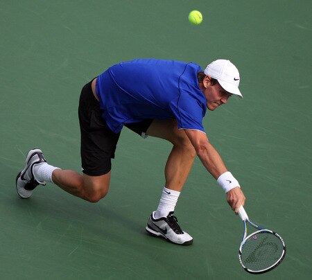 TOKYO - OCTOBER 09:  Tomas Berdych of the Czech Republic plays a backhand in his match against Mikhail Youzhny of Russia during day five of the Rakuten Open Tennis tournament at Ariake Colosseum on October 9, 2009 in Tokyo, Japan.  <br /><br /><span class="help">(Photo by Koichi Kamoshida/Getty Images)</span>