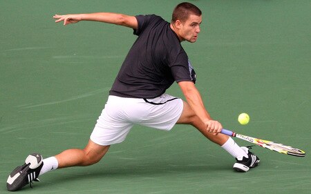 TOKYO - OCTOBER 09:  Mikhail Youzhny of Russia plays a backhand in his match against Tomas Berdych of the Czech Republic during day five of the Rakuten Open Tennis tournament at Ariake Colosseum on October 9, 2009 in Tokyo, Japan.  <br /><br /><span class="help">(Photo by Junko Kimura/Getty Images)</span>