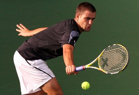 TOKYO - OCTOBER 09:  Mikhail Youzhny of Russia plays a backhand in his match against Tomas Berdych of the Czech Republic during day five of the Rakuten Open Tennis tournament at Ariake Colosseum on October 9, 2009 in Tokyo, Japan.  <br /><br /><span class="help">(Photo by Junko Kimura/Getty Images)</span>