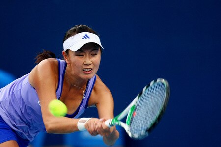 BEIJING - OCTOBER 09: Peng Shuai of China returns a shot against Nadia Petrova of Russia  in the quarter-finals during day eight of the 2009 China Open at the National Tennis Centre on October 9, 2009 in Beijing, China.  <br /><br /><span class="help">(Photo by Feng Li/Getty Images)</span>