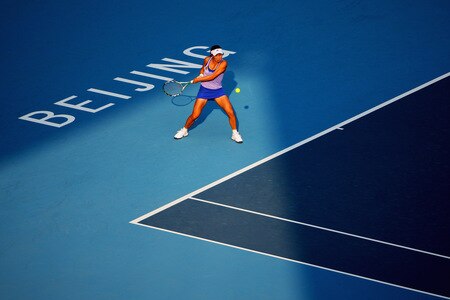 BEIJING - OCTOBER 09:  Peng Shuai of China returns a shot against Nadia Petrova of Russia  in the quarter-finals during day eight of the 2009 China Open at the National Tennis Centre on October 9, 2009 in Beijing, China.  <br /><br /><span class="help">(Photo by Feng Li/Getty Images)</span>