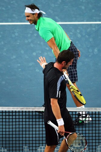 BEIJING - OCTOBER 09:  Rafael Nadal (Up) of Spain misses a shot against Marat Safin (Bellow) of Russia in the quarter-finals during day eight of the 2009 China Open at the National Tennis Centre on October 9, 2009 in Beijing, China.  <br /><br /><span class="help">(Photo by Feng Li/Getty Images)</span>