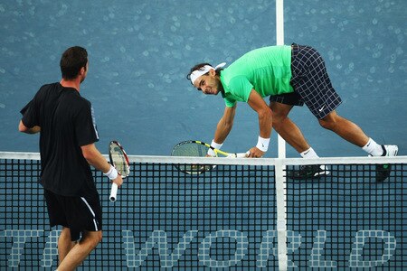 BEIJING - OCTOBER 09:  Rafael Nadal (Right) of Spain misses a shot against Marat Safin (Left) of Russia in the quarter-finals during day eight of the 2009 China Open at the National Tennis Centre on October 9, 2009 in Beijing, China.  <br /><br /><span class="help">(Photo by Feng Li/Getty Images)</span>