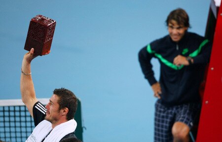 BEIJING - OCTOBER 09:  Marat Safin (L) of Russia holds up a Chinese personal seal spelling his name that was presented to him as a gift after losing his quarter-final match against Rafael Nadal of Spain during day eight of the 2009 China Open at the National Tennis Centre on October 9, 2009 in Beijing, China.  <br /><br /><span class="help">(Photo by Feng Li/Getty Images)</span>