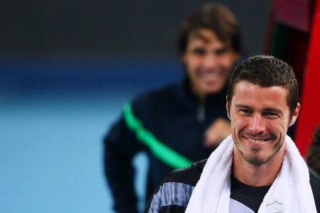 BEIJING - OCTOBER 09:  Marat Safin of Russia smiles as he acknowledges the crowd after losing his quarter-final match against Rafael Nadal (L) of Spain during day eight of the 2009 China Open at the National Tennis Centre on October 9, 2009 in Beijing, China.  <br /><br /><span class="help">(Photo by Feng Li/Getty Images)</span>