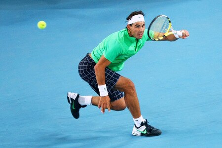 BEIJING - OCTOBER 09:  Rafael Nadal of Spain stretches to hit a forehand against Marat Safin of Russia during their quarter-final match on day eight of the 2009 China Open at the National Tennis Centre on October 9, 2009 in Beijing, China.  <br /><br /><span class="help">(Photo by Feng Li/Getty Images)</span>