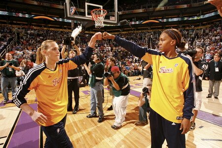 PHOENIX - OCTOBER 9: Katie Douglas #23 get a pound from Tamika Catchings #24 of the Indiana Fever against the Phoenix Mercury during Game Five of the WNBA Finals on October 9, 2009 at US Airways Center in Phoenix, Arizona. <br /><br /><span class="help">(Photo by Bill Baptist/NBAE via Getty Images)</span>