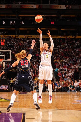 PHOENIX - OCTOBER 9: Diana Taurasi #3 of the Phoenix Mercury puts a shot up over Katie Douglas #23 of the Indiana Fever in Game five of the WNBA Finals played on October 9, 2009 at U.S. Airways Center in Phoenix, Arizona. <br /><br /><span class="help">(Photo by Barry Gossage/NBAE via Getty Images)</span>