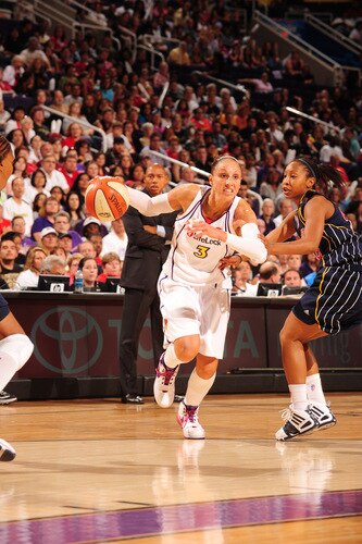 PHOENIX - OCTOBER 9: Diana Taurasi #3 of the Phoenix Mercury drives past Briann January #20 of the Indiana Fever in Game five of the WNBA Finals played on October 9, 2009 at U.S. Airways Center in Phoenix, Arizona. <br /><br /><span class="help">(Photo by Barry Gossage/NBAE via Getty Images)</span>