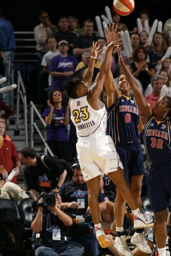 PHOENIX - OCTOBER 9: Cappie Pondexter #23 of the Phoenix Mercury shoots against Tammy Sutton-Brown #8 and Ebony Hoffman #32 of the Indiana Fever during Game Five of the WNBA Finals on October 9, 2009 at US Airways Center in Phoenix, Arizona. <br /><br /><span class="help">(Photo by Bill Baptist/NBAE via Getty Images)</span>
