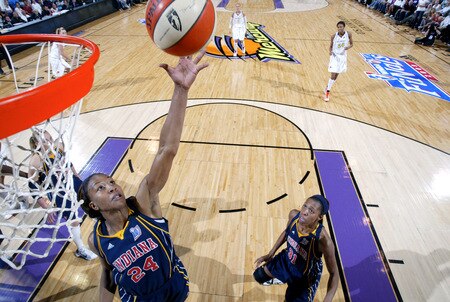 PHOENIX - OCTOBER 9: Tamika Catchings #24 of the Indiana Fever rebounds against the Phoenix Mercury during Game Five of the WNBA Finals on October 9, 2009 at US Airways Center in Phoenix, Arizona. <br /><br /><span class="help">(Photo by Bill Baptist/NBAE via Getty Images)</span>