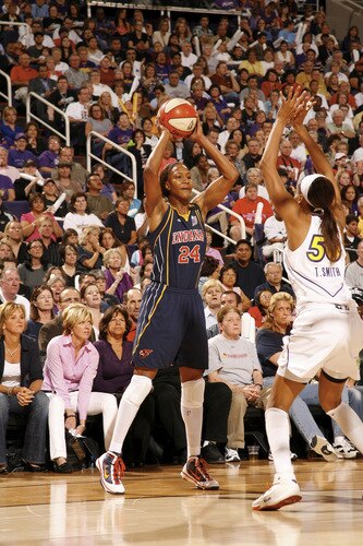 PHOENIX - OCTOBER 9: Tamika Catchings #24 of the Indiana Fever looks to pass against Tangela Smith #50 of the Phoenix Mercury during Game Five of the WNBA Finals on October 9, 2009 at US Airways Center in Phoenix, Arizona. <br /><br /><span class="help">(Photo by Bill Baptist/NBAE via Getty Images)</span>