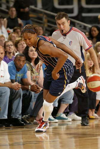 PHOENIX - OCTOBER 9: Tamika Catchings #24 of the Indiana Fever goes around the back against the Phoenix Mercury during Game Five of the WNBA Finals on October 9, 2009 at US Airways Center in Phoenix, Arizona. <br /><br /><span class="help">(Photo by Bill Baptist/NBAE via Getty Images)</span>