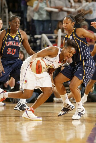 PHOENIX - OCTOBER 9: Cappie Pondexter #23 of the Phoenix Mercury drives against Briann January #20 of the Indiana Fever during Game Five of the WNBA Finals on October 9, 2009 at US Airways Center in Phoenix, Arizona. <br /><br /><span class="help">(Photo by Bill Baptist/NBAE via Getty Images)</span>