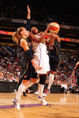 PHOENIX - OCTOBER 9: Le'coe Willingham #43 of the Phoenix Mercury drives for a shot between Katie Douglas #23 and Tamika Catchings #24 of the Indiana Fever in Game five of the WNBA Finals played on October 9, 2009 at U.S. Airways Center in Phoenix, Arizona. <br /><br /><span class="help">(Photo by Barry Gossage/NBAE via Getty Images)</span>