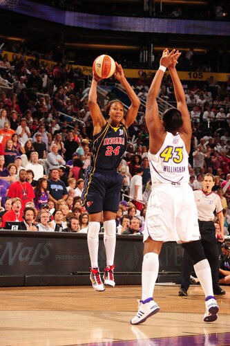 PHOENIX - OCTOBER 9: Tamika Catchings #24 of the Indiana Fever looks to pass around Le'coe Willingham #43 of the Phoenix Mercury in Game five of the WNBA Finals played on October 9, 2009 at U.S. Airways Center in Phoenix, Arizona. <br /><br /><span class="help">(Photo by Barry Gossage/NBAE via Getty Images)</span>