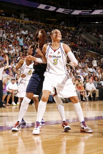 PHOENIX - OCTOBER 9: Diana Taurasi #3 of the Phoenix Mercury boxes out against Tamika Catchings #24 of the Indiana Fever during Game Five of the WNBA Finals on October 9, 2009 at US Airways Center in Phoenix, Arizona. <br /><br /><span class="help">(Photo by Bill Baptist/NBAE via Getty Images)</span>