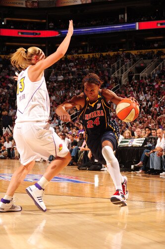 PHOENIX - OCTOBER 9: Tamika Catchings #24 of the Indiana Fever drives and draws a foul from Penny Taylor #13 of the Phoenix Mercury in Game five of the WNBA Finals played on October 9, 2009 at U.S. Airways Center in Phoenix, Arizona. <br /><br /><span class="help">(Photo by Barry Gossage/NBAE via Getty Images)</span>