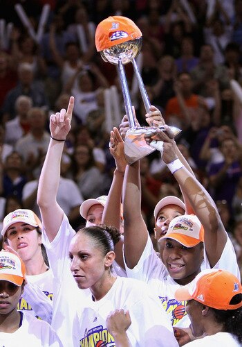 PHOENIX - OCTOBER 10:  (L-R) Brooke Smith #21, Diana Taurasi #3, Tangela Smith #50, Le'coe Willingham #43 and Temeka Johnson #2 of the Phoenix Mercury celebrate with the WNBA trophy after defeating the Indiana Fever in Game Five of the 2009 WNBA Finals at US Airways Center on October 10, 2009 in Phoenix, Arizona. The Mercury defeated the Fever 94-86. <br /><br /><span class="help">(Photo by Christian Petersen/Getty Images)</span>