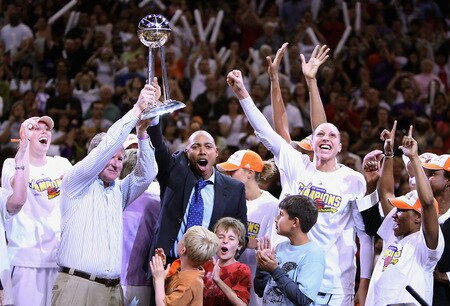PHOENIX - OCTOBER 10:  (L-R) Penny Taylor #13, owner Robert Sarver, head coach Corey Gaines, Diana Taurasi #3 and Temeka Johnson #2 of the Phoenix Mercury celebrate with the WNBA trophy after defeating the Indiana Fever in Game Five of the 2009 WNBA Finals at US Airways Center on October 10, 2009 in Phoenix, Arizona. The Mercury defeated the Fever 94-86. <br /><br /><span class="help">(Photo by Christian Petersen/Getty Images)</span>