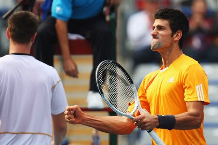 BEIJING - OCTOBER 10:  Novak Djokovic (Right) of Serbia celebrates winning against Robin Soderling (Left) of Sweden in the Semifinals during day nine of the 2009 China Open at the National Tennis Centre on October 10, 2009 in Beijing, China.  <br /><br /><span class="help">(Photo by Feng Li/Getty Images)</span>