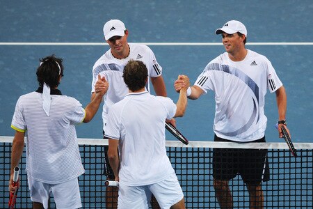 BEIJING - OCTOBER 10:  Bob Bryan and Mike Bryan of USA (Up) shakes hands with Julien Benneteau and Jeremy Chardy of France after winning the Semifinals during day nine of the 2009 China Open at the National Tennis Centre on October 10, 2009 in Beijing, China. <br /><br /><span class="help">(Photo by Feng Li/Getty Images)</span>