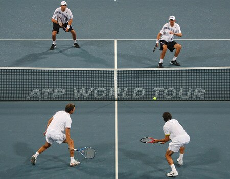 BEIJING - OCTOBER 10:  Bob Bryan and Mike Bryan of USA return a shot against Julien Benneteau and Jeremy Chardy of France (Below) in the Semifinals during day nine of the 2009 China Open at the National Tennis Centre on October 10, 2009 in Beijing, China.  <br /><br /><span class="help">(Photo by Feng Li/Getty Images)</span>