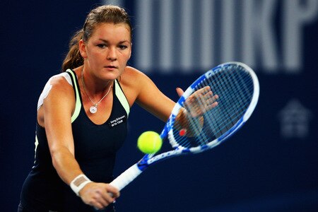 BEIJING - OCTOBER 10:  Agnieszka Radwanska of Poland returns a shot against Marion Bartoli of France in the Semifinals during day nine of the 2009 China Open at the National Tennis Centre on October 10, 2009 in Beijing,  <br /><br /><span class="help">(Photo by Feng Li/Getty Images)</span>