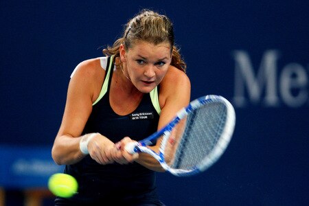 BEIJING - OCTOBER 10:  Agnieszka Radwanska of Poland returns a shot against Marion Bartoli of France in the Semifinals during day nine of the 2009 China Open at the National Tennis Centre on October 10, 2009 in Beijing,  <br /><br /><span class="help">(Photo by Feng Li/Getty Images)</span>