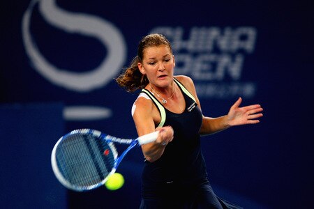BEIJING - OCTOBER 10:  Agnieszka Radwanska of Poland returns a shot against Marion Bartoli of France in the Semifinals during day nine of the 2009 China Open at the National Tennis Centre on October 10, 2009 in Beijing,  <br /><br /><span class="help">(Photo by Feng Li/Getty Images)</span>