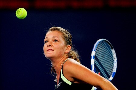 BEIJING - OCTOBER 10:  Agnieszka Radwanska of Poland hits the ball in celebration of winning against Marion Bartoli of France in the Semifinals during day nine of the 2009 China Open at the National Tennis Centre on October 10, 2009 in Beijing,   <br /><br /><span class="help">(Photo by Feng Li/Getty Images)</span>