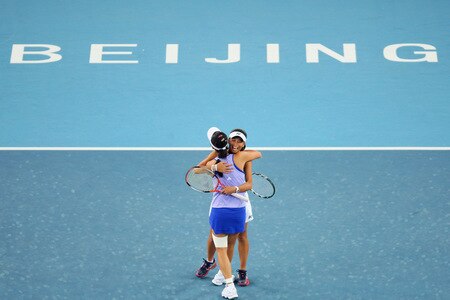 BEIJING - OCTOBER 10:  (L-R) Hsieh Su-Wei of Taiwan and Peng Shuai of China celebrates winning against Alla Kudryavtseva and Ekaterina Makarova of Russia in the women's doubles final match during day nine of the 2009 China Open at the National Tennis Centre on October 10, 2009 in Beijing, China. Hsieh Su-Wei of Taiwan and Peng Shuai of China win the tournament.  <br /><br /><span class="help">(Photo by Feng Li/Getty Images)</span>