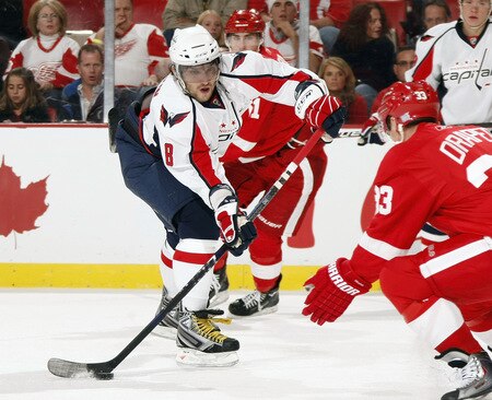 DETROIT - OCTOBER 10: Alex Ovechkin #8 of the Washington Capitals looks to get a shot past Kris Draper #33 of the Detroit Red Wings on October 10, 2009 at Joe Louis Arena in Detroit, Michigan. <br /><br /><span class="help">(Photo by Gregory Shamus/Getty Images)</span>