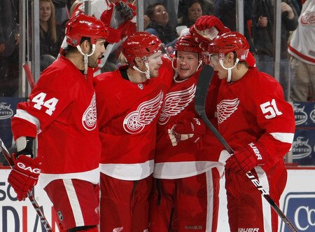 DETROIT - OCTOBER 10:  Jason Williams #29 of the Detroit Red Wings celebrates a second period goal with Nicklas Lidstrom #5, Valtteri Filppula #51 and Todd Bertuzzi #44 while playing the Washington Capitals on October 10, 2009 at Joe Louis Arena in Detroit, Michigan.  <br /><br /><span class="help">(Photo by Gregory Shamus/Getty Images)</span>