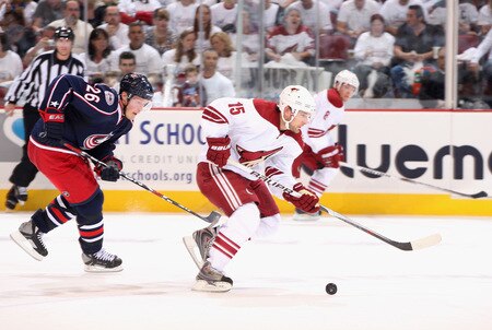 GLENDALE, AZ - OCTOBER 10:  Matthew Lombardi #15 of the Phoenix Coyotes skates with the puck past Samuel Pahlsson #26 of the Columbus Blue Jackets during the NHL game at Jobing.com Arena on October 10, 2009 in Glendale, Arizona.  <br /><br /><span class="help">(Photo by Christian Petersen/Getty Images)</span>