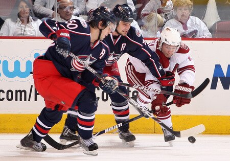 GLENDALE, AZ - OCTOBER 10:  Petr Prucha #16 of the Phoenix Coyotes battles for the puck with Rostislav Klesla #97 and Antoine Vermette #50 of the Columbus Blue Jackets during the NHL game at Jobing.com Arena on October 10, 2009 in Glendale, Arizona. The Blue Jackets defeated the Coyotes 2-0. <br /><br /><span class="help">(Photo by Christian Petersen/Getty Images)</span>