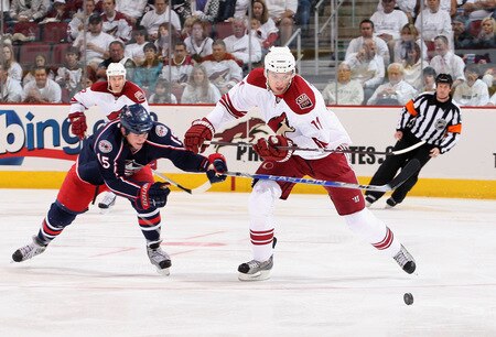 GLENDALE, AZ - OCTOBER 10:  Martin Hanzal #11 of the Phoenix Coyotes skates after the puck under pressure from Derek Dorsett #15 of the Columbus Blue Jackets during the NHL game at Jobing.com Arena on October 10, 2009 in Glendale, Arizona.  The Blue Jackets defeated the Coyotes 2-0. <br /><br /><span class="help">(Photo by Christian Petersen/Getty Images)</span>