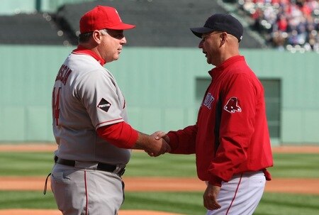 BOSTON - OCTOBER 11:  Mike Scioscia #14 manager of the Los Angeles Angels of Anaheim and Terry Francona #47of the Boston Red Sox shake hands before Game Three of the ALDS during the 2009 MLB Playoffs at Fenway Park on October 11, 2009 in Boston, Massachusetts. <br /><br /><span class="help">(Photo by Elsa/Getty Images)</span>