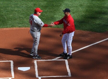 BOSTON - OCTOBER 11:  (L-R) Manager Mike Scioscia of the Los Angeles Angels of Anaheim shakes hands with Terry Francona of the Boston Red Sox before Game Three of the ALDS during the 2009 MLB Playoffs at Fenway Park on October 11, 2009 in Boston, Massachusetts. <br /><br /><span class="help">(Photo by Jim Rogash/Getty Images)</span>