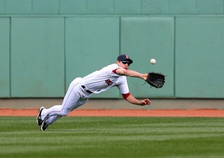 BOSTON - OCTOBER 11:  Jacoby Ellsbury #46 of the Boston Red Sox makes a diving catch on a Bobby Abreu #53 of the Los Angeles Angels of Anaheim flyout in the third inning of Game Three of the ALDS during the 2009 MLB Playoffs at Fenway Park on October 11, 2009 in Boston,  Massachusetts. <br /><br /><span class="help">(Photo by Jim Rogash/Getty Images)</span>