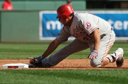 BOSTON - OCTOBER 11: Juan Rivera #20 of the Los Angeles Angels of Anaheim steals second base against the Boston Red in the second inning of Game Three of the ALDS Sox during the 2009 MLB Playoffs at Fenway Park on October 11, 2009 in Boston, Massachusetts.  <br /><br /><span class="help">(Photo by Elsa/Getty Images)</span>